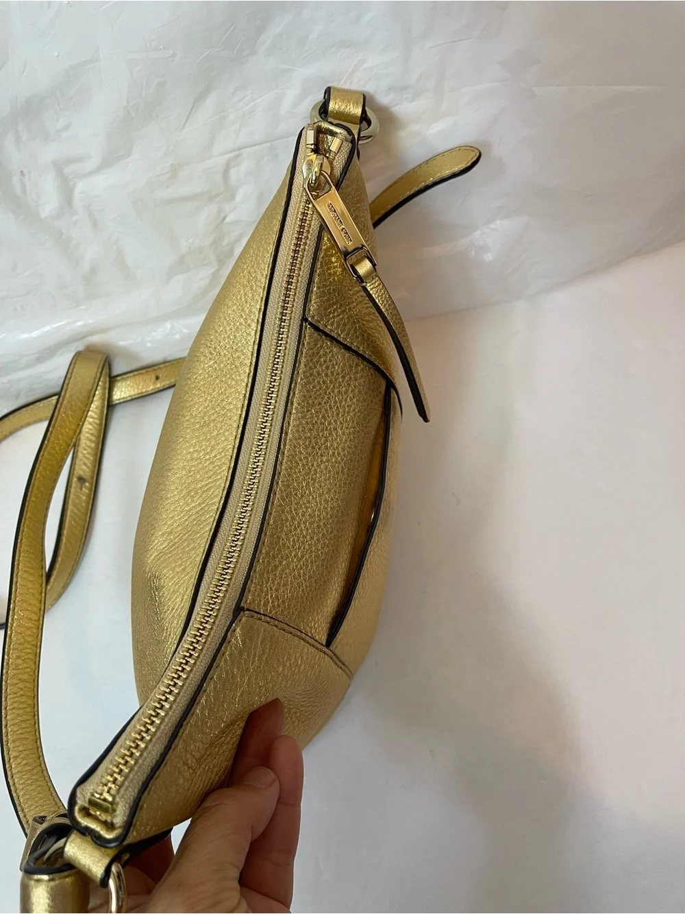 Michael Kors Gold leather hobo crossbody bag.